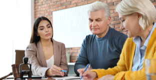 Older couple filing bankruptcy paperwork with a Licensed Insolvency Trustee